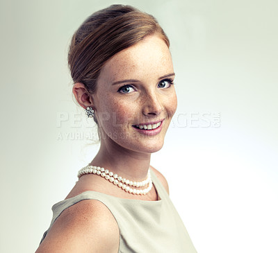 Buy stock photo Portrait, fashion and beauty of happy woman in studio isolated on a gray background. Face, freckles and skin of young person in vintage clothes for style, retro or elegance with necklace in Ireland