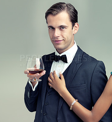 Buy stock photo Man, studio and portrait with wine, luxury and fashion for class or rich retro smile. Gentleman, tuxedo and spy or agent with confidence, style and positive attitude isolated on white background