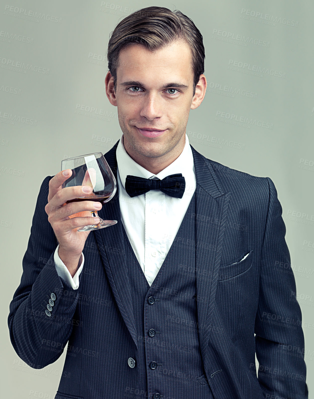 Buy stock photo A portrait of a dapper young man with a glass of wine wearing a vintage suit