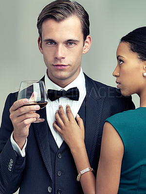 Buy stock photo Alcohol, fashion and portrait of couple in studio with elegant, formal and stylish clothes for event. Luxury, party and man and woman with drink and confidence, pride and glamour on gray background