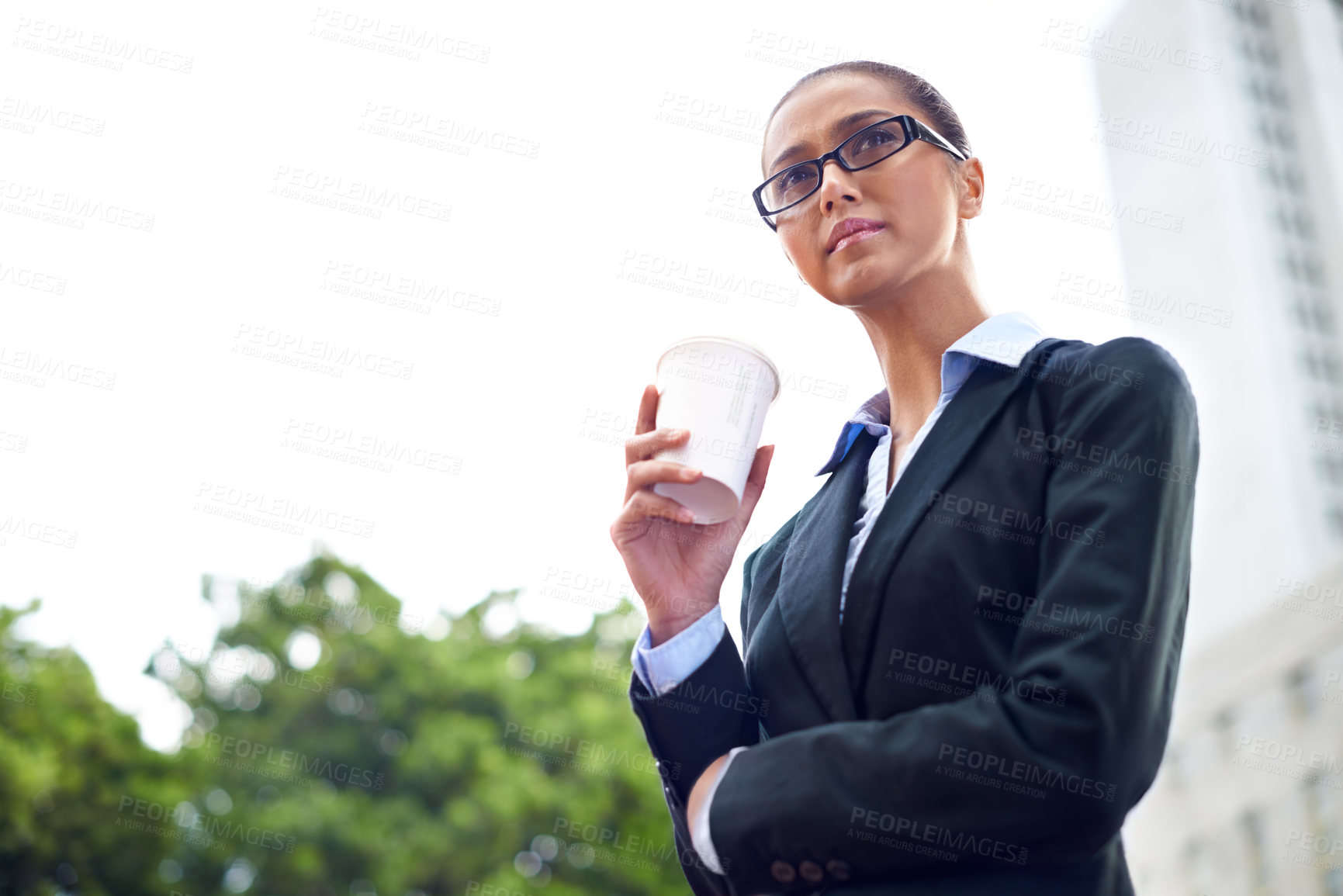 Buy stock photo Shot of a businesswoman holding a cup of coffee during her break