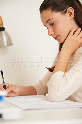 Buy stock photo Teen, girl and book for learning in home, student and homework for assignment or project. Female person, course and schoolwork on weekend, education and knowledge or information by writing at desk