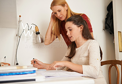 Buy stock photo Teen, mom and help with studying in home, student and support for assignment or project. Mother, girl and schoolwork on weekend in bedroom, education and assistance or guidance for learning by desk