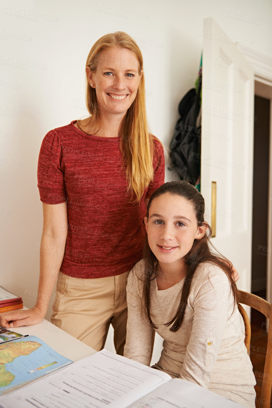 Buy stock photo Study, portrait and mother help daughter with smile for child, growth and development with education. Parent, woman and mom with support for girl, book and map on table for geography homework