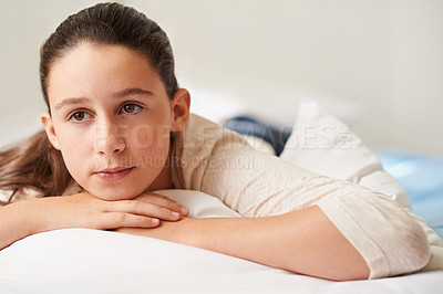 Buy stock photo Girl, relax and thinking on bed in home, tired and peace or calm for waking up on weekend. Female person, pillow and comfortable in bedroom for fatigue or contemplating, blanket and ponder for lazy
