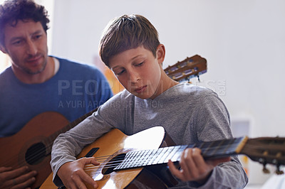 Buy stock photo Learning, guitar and child with teacher for music, lesson and development of skill with instrument. Playing, practice and man helping kid in education as musician mentor in acoustic sound on strings