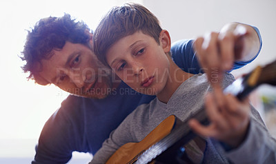 Buy stock photo Learning, music and child with teacher for guitar, lesson and education of skill with instrument. Playing, practice or man training kid in development as musician or mentor in creative study of sound