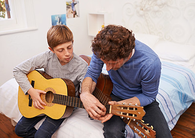Buy stock photo Guitar, teacher and learning music with child in lesson for development of skill on instrument. Playing, practice and man helping musician kid in education with advice as mentor in acoustic sound