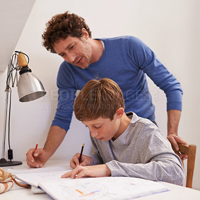 Buy stock photo Education, father and son with homework, talking and learning at home, studying and writing. Family, happy dad and male child with books, knowledge and teaching for growth, development and lesson