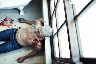 Buy stock photo High angle shot of a dead man lying on the floor of his bathroom