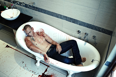 Buy stock photo High angle shot of a dead man lying in a bathtub