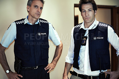Buy stock photo Portrait of two police officers at a crime scene
