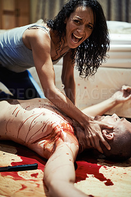 Buy stock photo Cropped shot of a distraught young woman finding her partner bloodied and dead on the floor