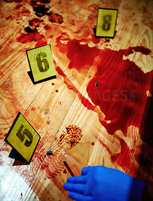 Buy stock photo Cropped shot of a hand collecting evidence from bloody crime scene floor