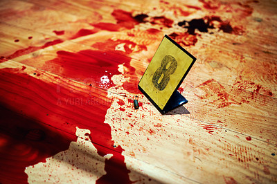 Buy stock photo Shot of Cropped shot two bullet casings on a bloody crime scene floor