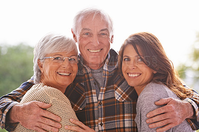 Buy stock photo A cropped portrait of a happy senior couple and their adult daughter at home