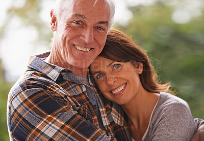 Buy stock photo Senior couple, happy and portrait for hug, love or outdoor in nature with connection for retirement. Woman, elderly man and embrace on patio with pride, care or smile  in backyard by trees in Germany