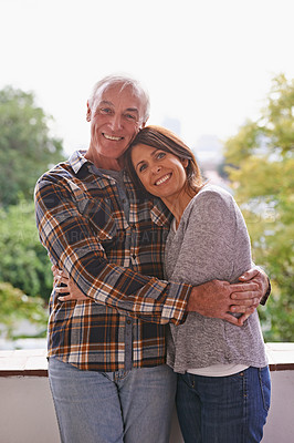 Buy stock photo Senior couple, happy and portrait on balcony with hug, love and outdoor with connection for retirement. Woman, elderly man and embrace on patio with pride, care and smile at apartment in Germany