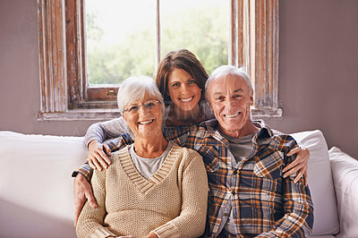 Buy stock photo A cropped portrait of a happy senior couple and their adult daughter at home