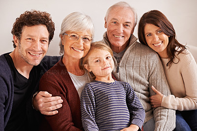Buy stock photo Grandparents, parents and child on couch for portrait with hug, care or love with generations for bonding in home. Mother, father and senior people with kid for embrace on lounge sofa in family house