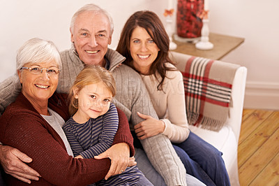 Buy stock photo Grandparents, parents and kid on couch for portrait with hug, care or love with generations for bonding in home. Mother, father and senior people with child for embrace on lounge sofa in family house
