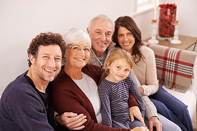 Buy stock photo Grandparents, parents and kid on sofa for portrait with hug, care or love with generations for bonding in home. Mother, father and senior people with child for embrace on lounge couch in family house