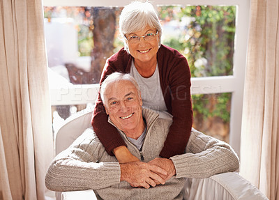 Buy stock photo Couple, senior and portrait with hug, window and home for happy retirement. Mature man, woman and marriage with elderly, care and love for healthy relationship and romantic rest and relaxation