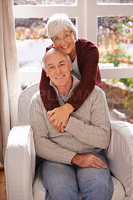 Buy stock photo A portrait of a happy mature couple spending time together at home