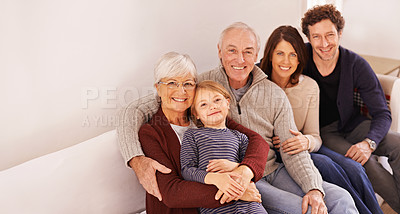 Buy stock photo Grandparents, generations and kid on couch for portrait with hug, care or love with parents for bonding in home. Mother, father and senior people with child for embrace on lounge sofa in family house