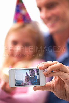 Buy stock photo Selfie, cellphone and portrait for child and man on photo for birthday, party and hat for celebration and cupcake. Father, daughter and happy with tech in hand for childhood, joy and adorable 