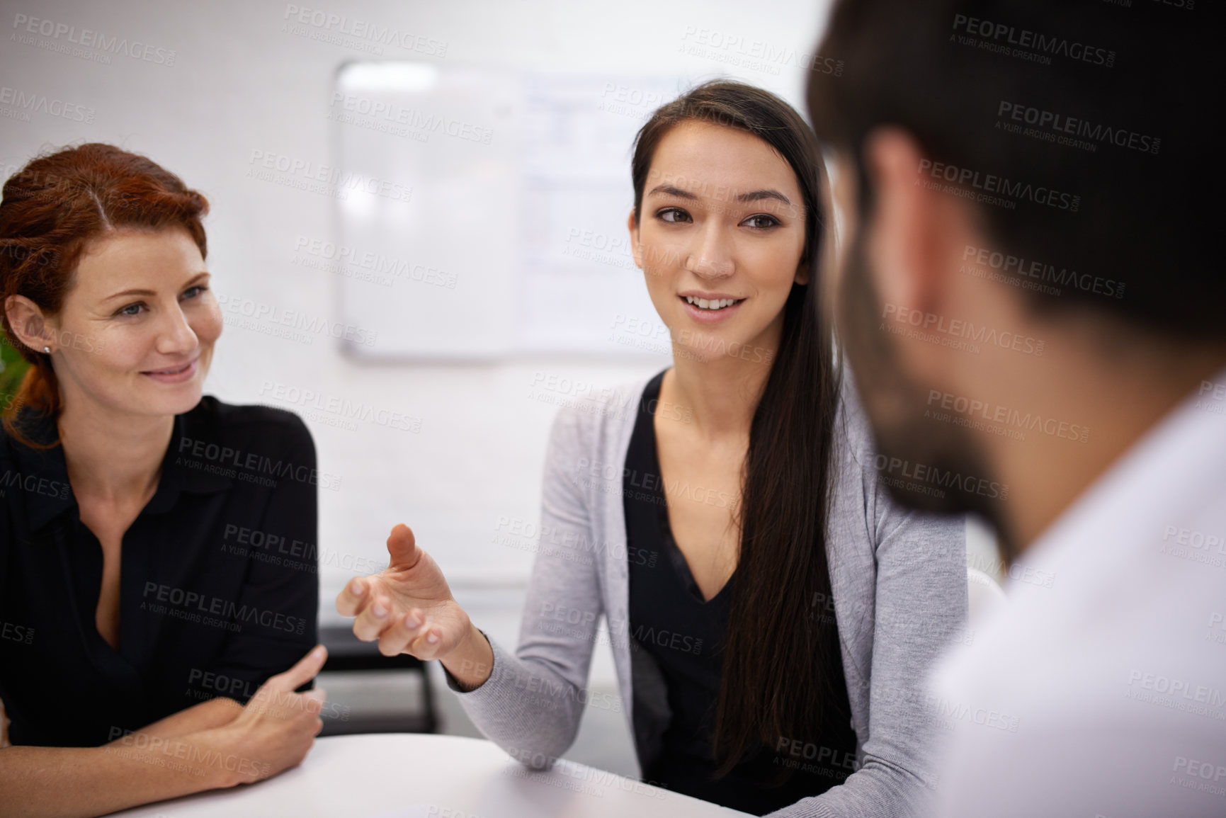 Buy stock photo Shot of businesspeople having a discussion in an office