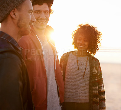 Buy stock photo Diverse, friends and beach with happiness for support or break on vacation with smile, care and together in New York. People, talking and relax in ocean on summer holiday for bonding and sunset
