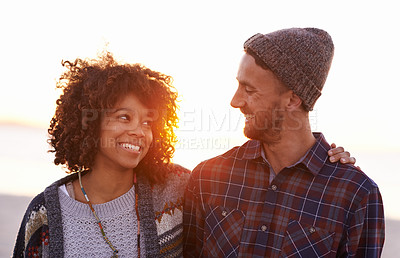 Buy stock photo Travel, love and happy couple at beach with hug, support or bonding on sunset walk in nature. Smile, care and people embrace at the ocean for sunrise journey, adventure or romance in Hawaii together