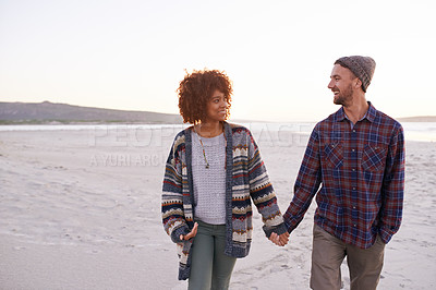 Buy stock photo Couple, ocean and walking holding hands in nature, happy calm people on vacation. Sea, outdoor and partners in love with respect and care, date and romantic walk for relax with seaside sunrise
