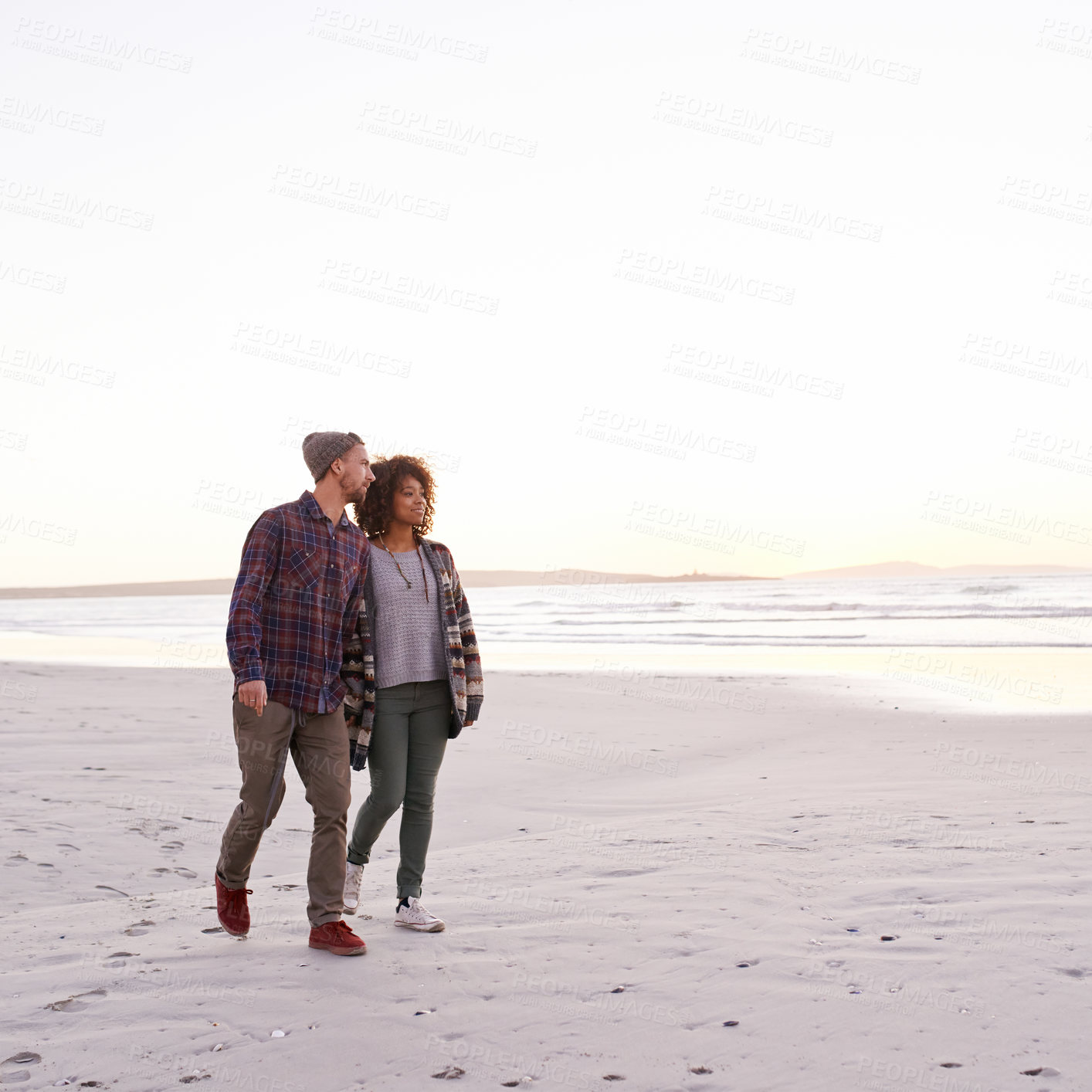 Buy stock photo Couple, beach and walking together in nature, happy calm people on vacation. Ocean, outdoor and partners in love with respect and care, date and romantic stroll for relax with seaside sunrise
