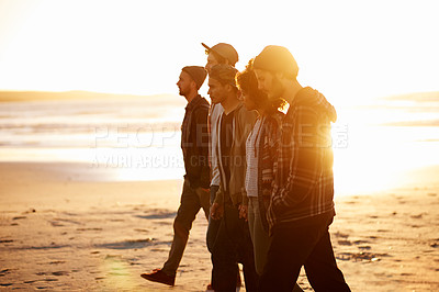 Buy stock photo Sunset, beach or friends walking in nature for vacation, bonding or holiday outdoor together. Lens flare, journey or gen z group of people at sea for fresh air, sunshine or sunrise ocean adventure