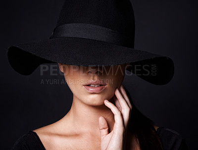 Buy stock photo Portrait of an attractive woman wearing a black hat