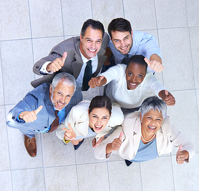 Buy stock photo Portrait, business people and thumbs up for good job, teamwork or collaboration together in office. Top view, emoji and diversity group of employee workers for approval, agreement or yes hand gesture