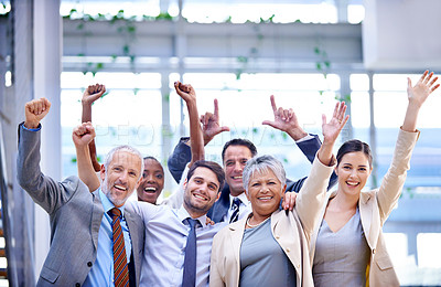 Buy stock photo Shot of a group of enthusiastic businesspeople celebrating