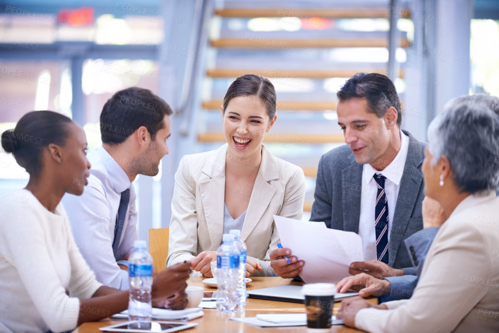 Buy stock photo A group of businesspeople having a lively meeting together