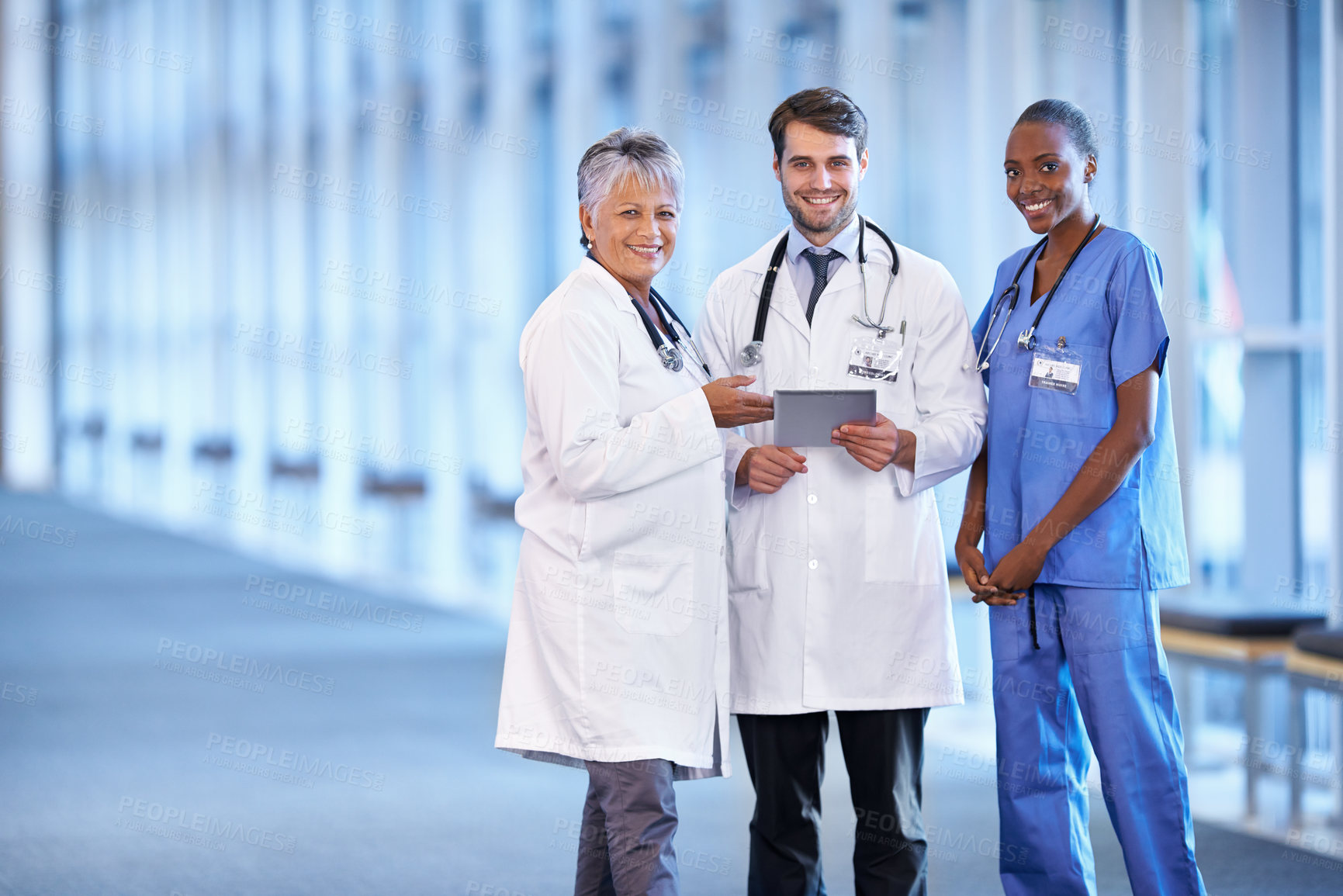 Buy stock photo Portrait, tablet and smile of medical group in hospital for healthcare service in clinic. Happy nurse, diverse team and doctors on technology for collaboration and cooperation of people together