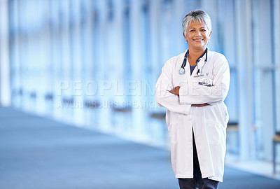 Buy stock photo Portrait, healthcare and arms crossed with a senior doctor standing in a hospital corridor for research or insurance. Medical, trust and technology with a woman medicine professional in a clinic