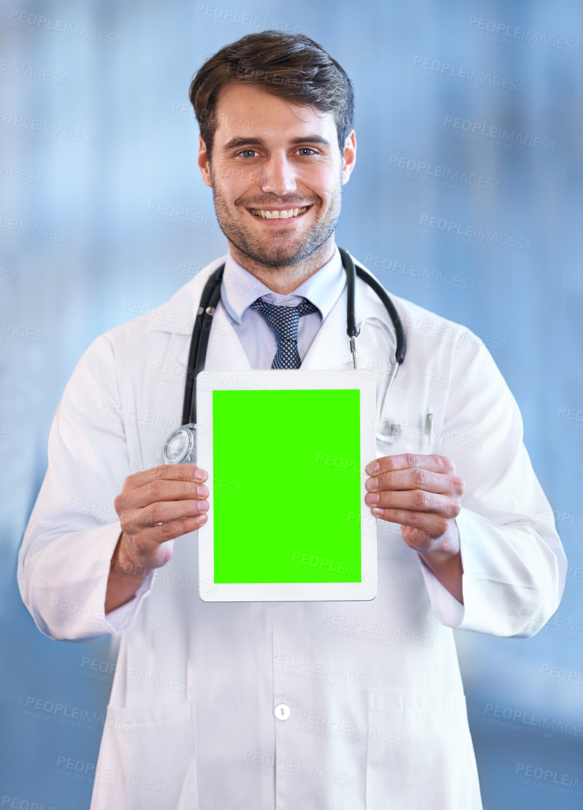 Buy stock photo Doctor, smile and portrait with tablet for green screen, marketing and healthcare for advertising, present or advice for info. Young person and happy with presentation on tech for online and internet