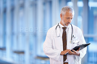 Buy stock photo Checklist, serious doctor and man reading in hospital for healthcare, wellness and notes. Clipboard, medical professional and mature surgeon with paperwork, results and report on chart in clinic