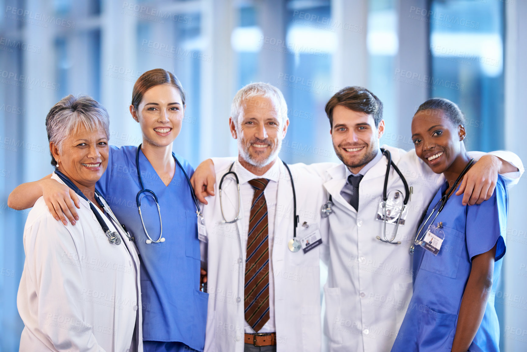 Buy stock photo Healthcare, team and portrait of doctors and nurses standing in a corridor of the hospital. Confidence, diversity and happy professional medical workers with smile in collaboration in medicare clinic