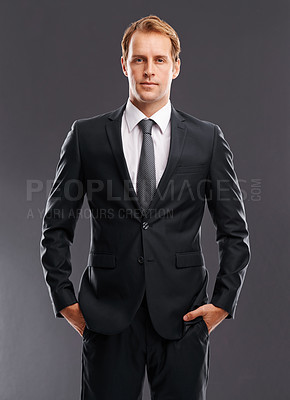Buy stock photo Businessman, boss and suit in formal wear standing against a grey studio background. Portrait of isolated CEO entrepreneur man model posing in confidence for classy profile as a career executive