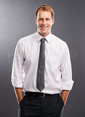 Buy stock photo Happy, corporate and confident portrait of man with optimistic career mindset and proud smile. Professional businessman smiling with confidence and satisfaction at isolated gray background.