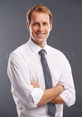 Buy stock photo Leader, happy and proud portrait of businessman with optimistic career mindset and happy smile. Professional corporate man smiling with confidence and arms crossed at isolated gray background.
