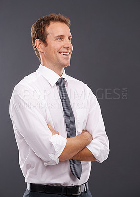 Buy stock photo Thinking, vision and mindset with a business man in studio on a gray background for advertising or marketing. Idea, growth or future mission with a handsome male employee standing arms crossed indoor