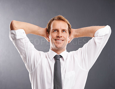 Buy stock photo Business man, happy and thinking to relax with a smile and idea for future, vision and career in studio. Face of a male entrepreneur with hands behind head to think about decision, ideas or choice